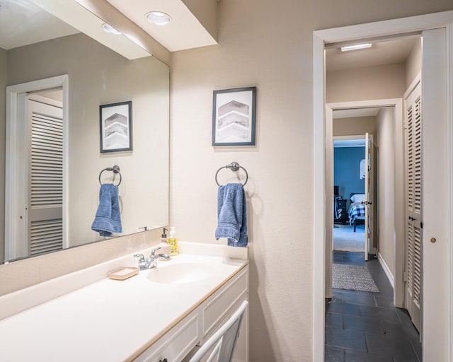 bathroom with vanity and tile patterned flooring