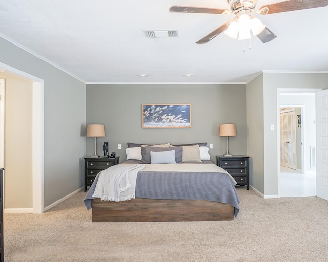 bedroom with crown molding, light colored carpet, and ceiling fan