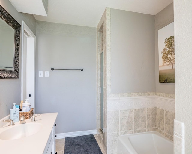 bathroom with vanity, independent shower and bath, and tile patterned flooring