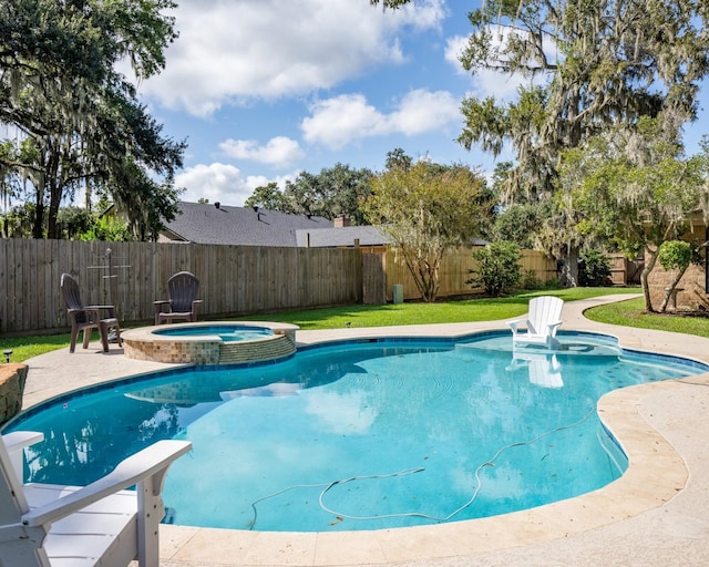 view of swimming pool with an in ground hot tub and a patio