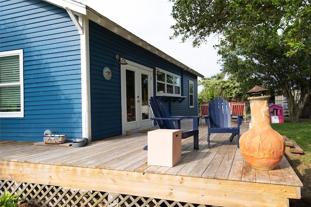 wooden deck featuring french doors