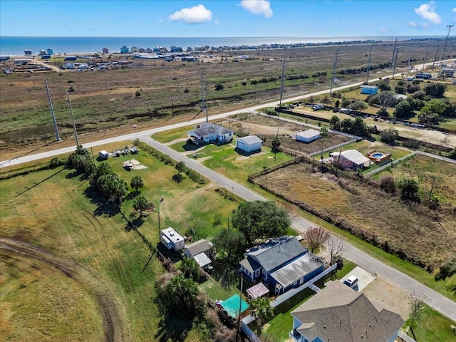 birds eye view of property with a rural view and a water view