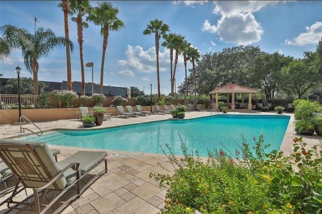 view of swimming pool with a patio area and a gazebo