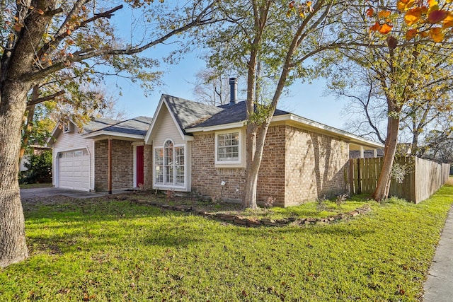 view of front of home featuring a garage and a front lawn