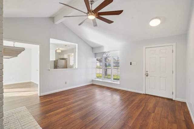 interior space featuring ceiling fan, dark wood-type flooring, and lofted ceiling with beams