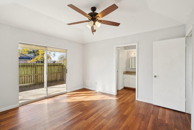 unfurnished room featuring ceiling fan and dark wood-type flooring