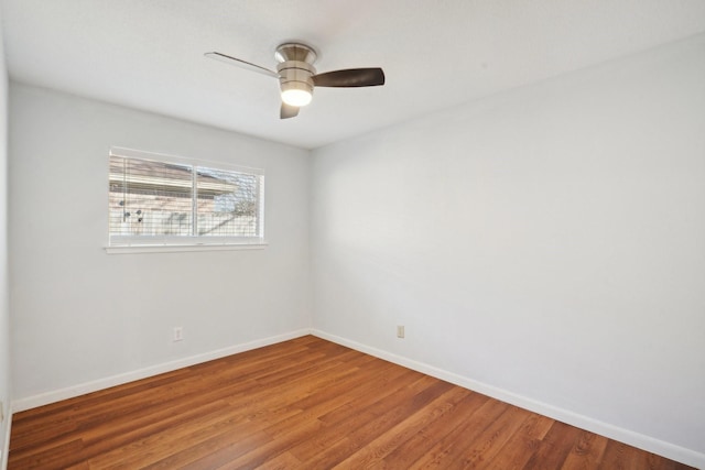 spare room with ceiling fan and hardwood / wood-style floors