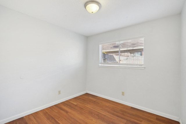 empty room featuring wood-type flooring