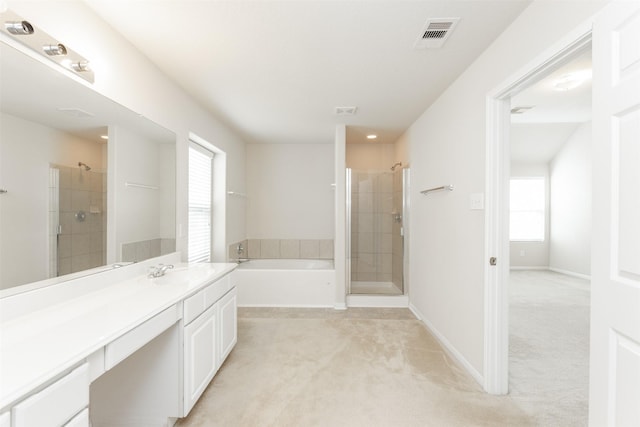 bathroom with vanity and separate shower and tub