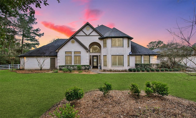 view of front of house with a lawn