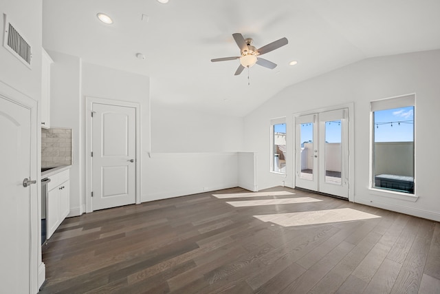 unfurnished living room with french doors, ceiling fan, lofted ceiling, and dark hardwood / wood-style floors