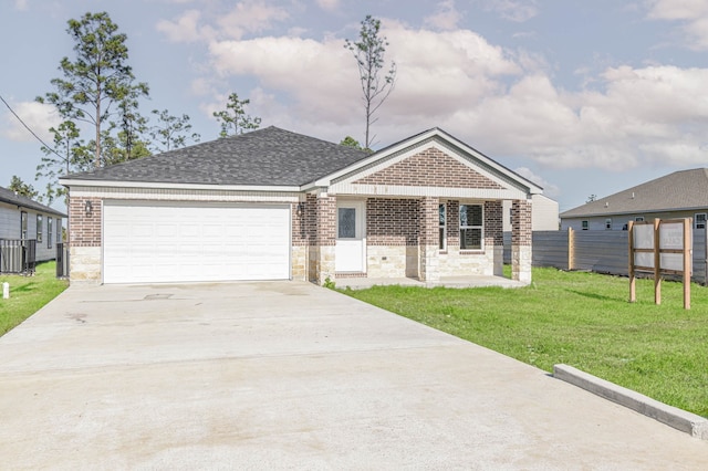 view of front of house with a garage and a front lawn