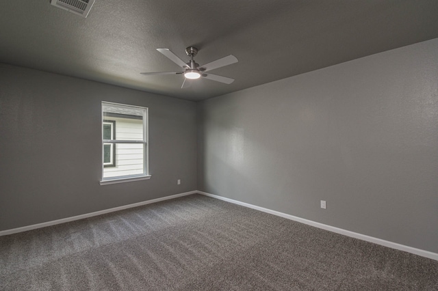 unfurnished room with ceiling fan, carpet, and a textured ceiling