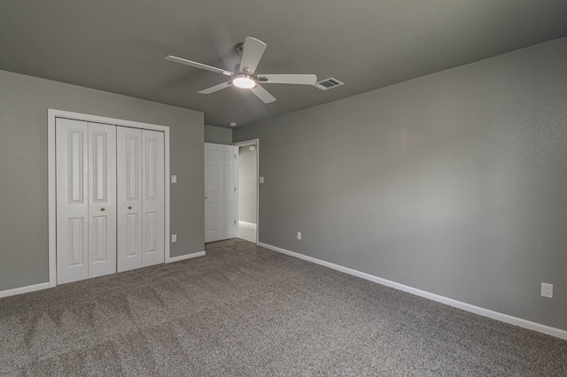 unfurnished bedroom featuring carpet, a closet, and ceiling fan