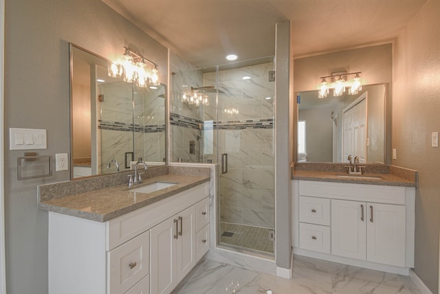 bathroom featuring an enclosed shower and vanity