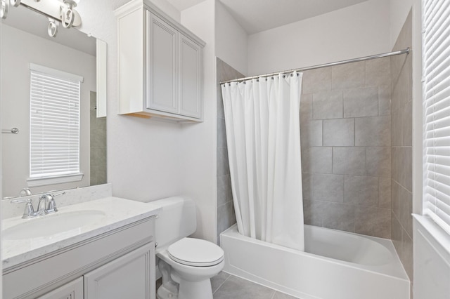 full bathroom featuring vanity, toilet, tile patterned floors, and shower / bath combo