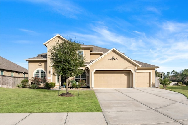 view of front of house featuring a garage and a front lawn