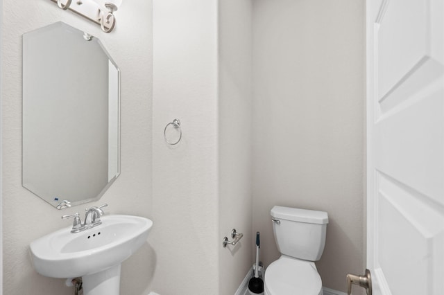 bathroom with sink and toilet