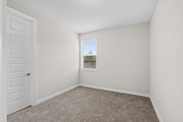 unfurnished room with carpet flooring