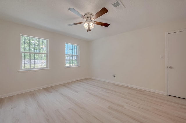 spare room with ceiling fan and light hardwood / wood-style flooring