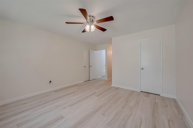 unfurnished bedroom with light wood-type flooring and ceiling fan