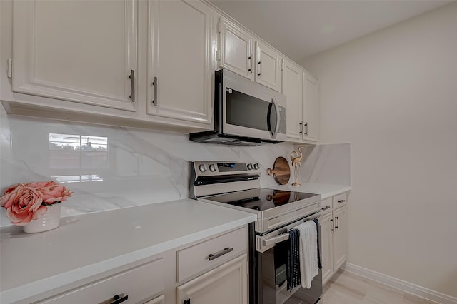 kitchen with white cabinets and stainless steel appliances