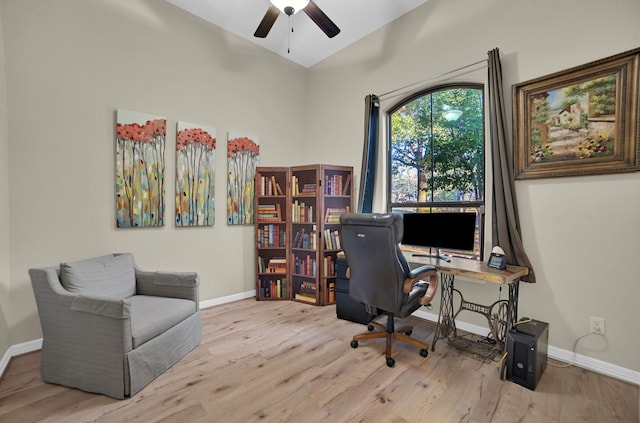 home office featuring light hardwood / wood-style flooring and ceiling fan