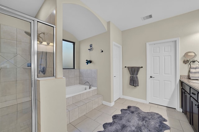 bathroom with tile patterned floors, separate shower and tub, and vanity