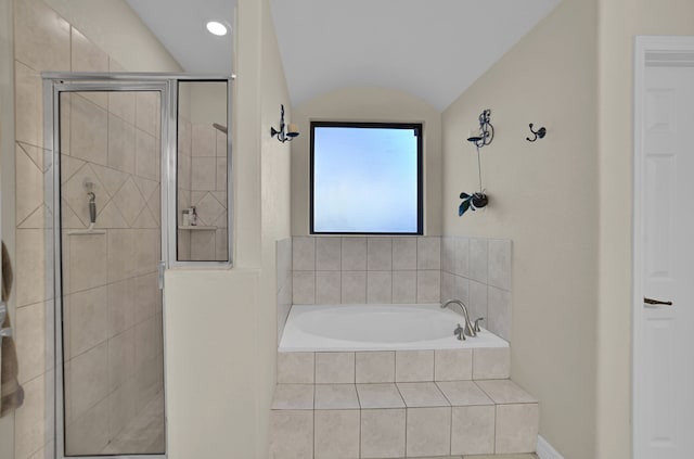 bathroom featuring independent shower and bath and vaulted ceiling