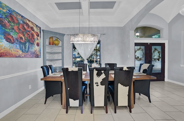 tiled dining area featuring ornamental molding, coffered ceiling, and french doors