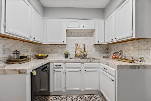 kitchen featuring white cabinetry, dishwasher, and tasteful backsplash