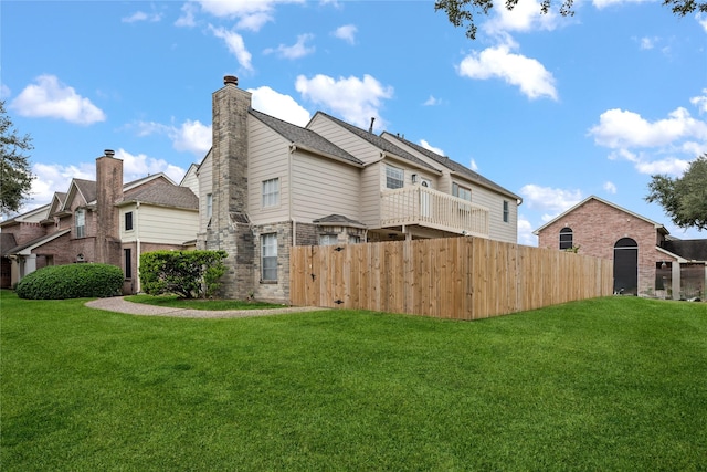 back of house with a yard