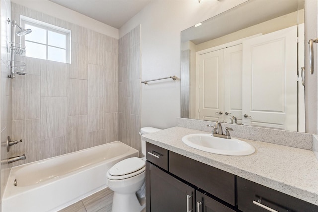 full bathroom with vanity, tile patterned floors, bathtub / shower combination, and toilet