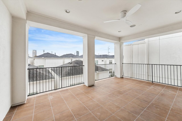 view of patio featuring a balcony and ceiling fan