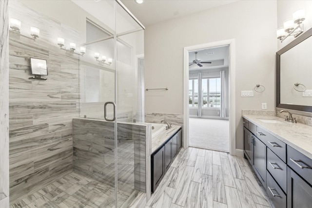 bathroom with vanity, ceiling fan, and separate shower and tub