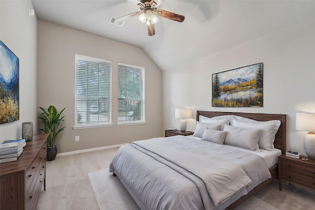 carpeted bedroom featuring vaulted ceiling and ceiling fan