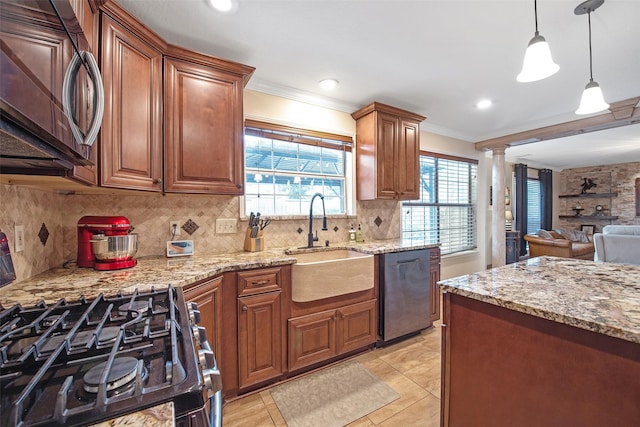 kitchen with tasteful backsplash, ornamental molding, appliances with stainless steel finishes, and sink