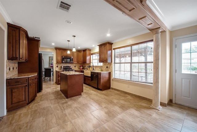 kitchen with ornate columns, hanging light fixtures, ornamental molding, a center island, and stainless steel appliances