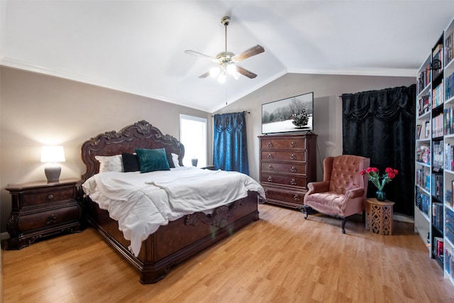 bedroom with ceiling fan, vaulted ceiling, and light wood-type flooring