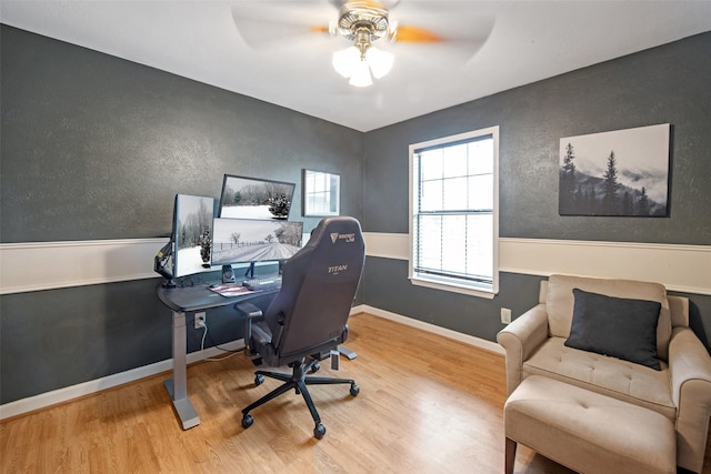 office area with hardwood / wood-style floors and ceiling fan