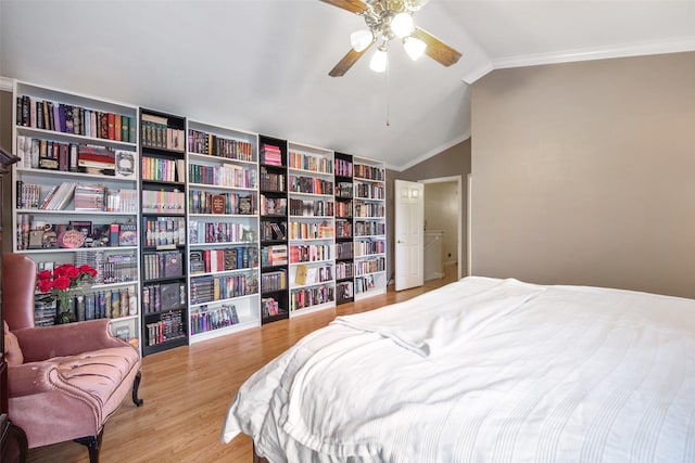 bedroom featuring ceiling fan, lofted ceiling, crown molding, and light hardwood / wood-style floors