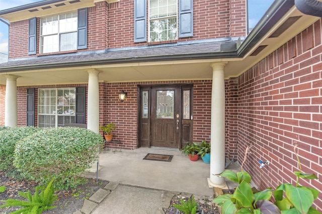 property entrance featuring a porch