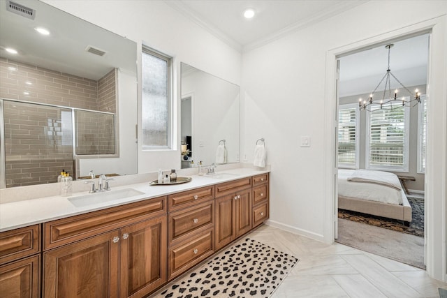 bathroom featuring tile patterned floors, a shower with door, vanity, ornamental molding, and a notable chandelier