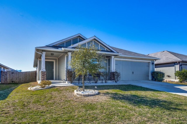 view of front of home featuring a garage and a front lawn