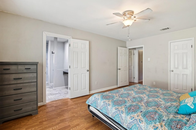 bedroom featuring light wood-type flooring and ceiling fan