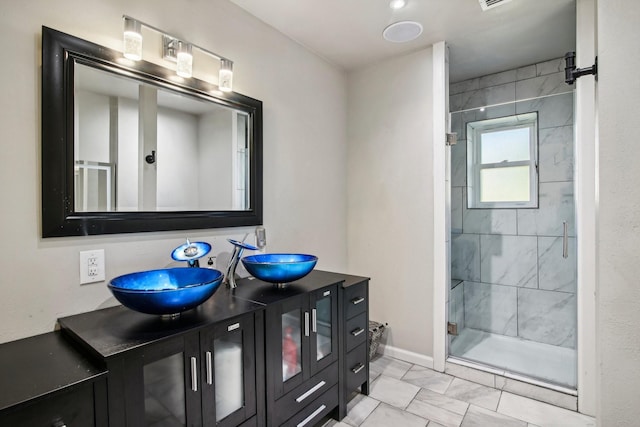 bathroom featuring vanity and walk in shower