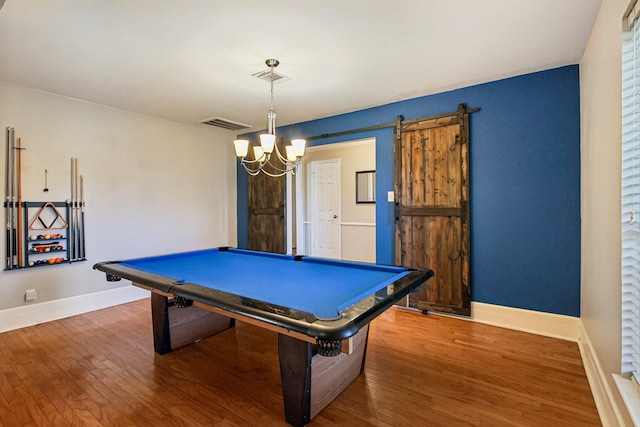 rec room with hardwood / wood-style floors, billiards, and a barn door