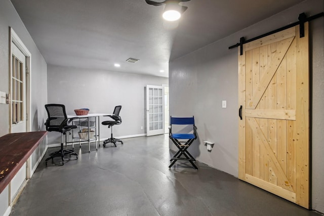 home office with french doors and a barn door