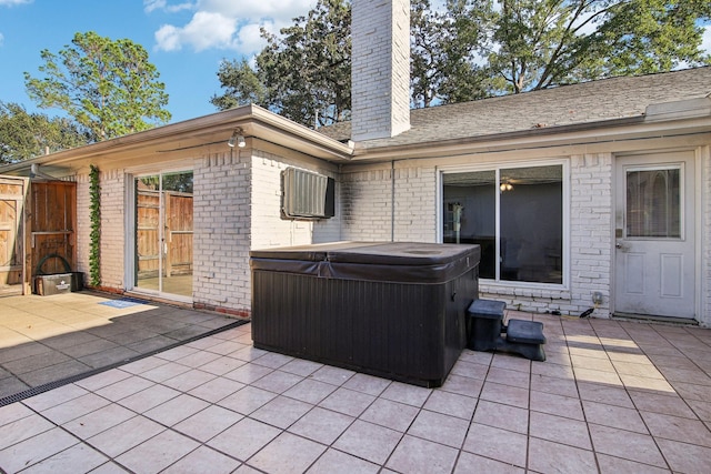 view of patio / terrace with a hot tub