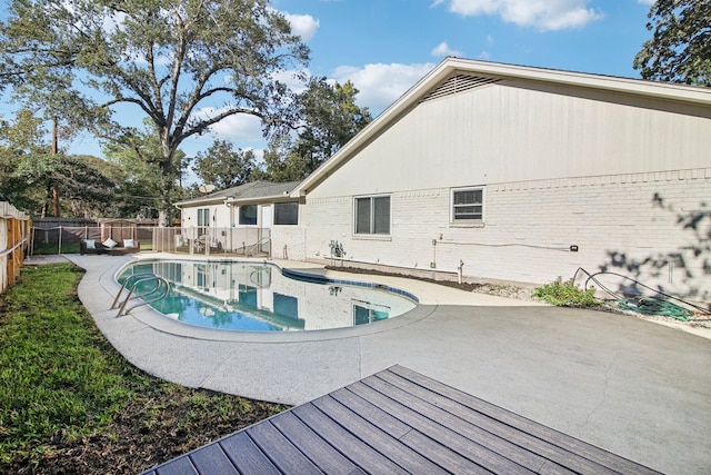 view of swimming pool with a patio area